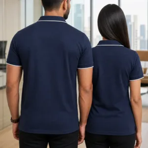 Professional Indian male and female models wearing black polo t-shirts in a modern office setting